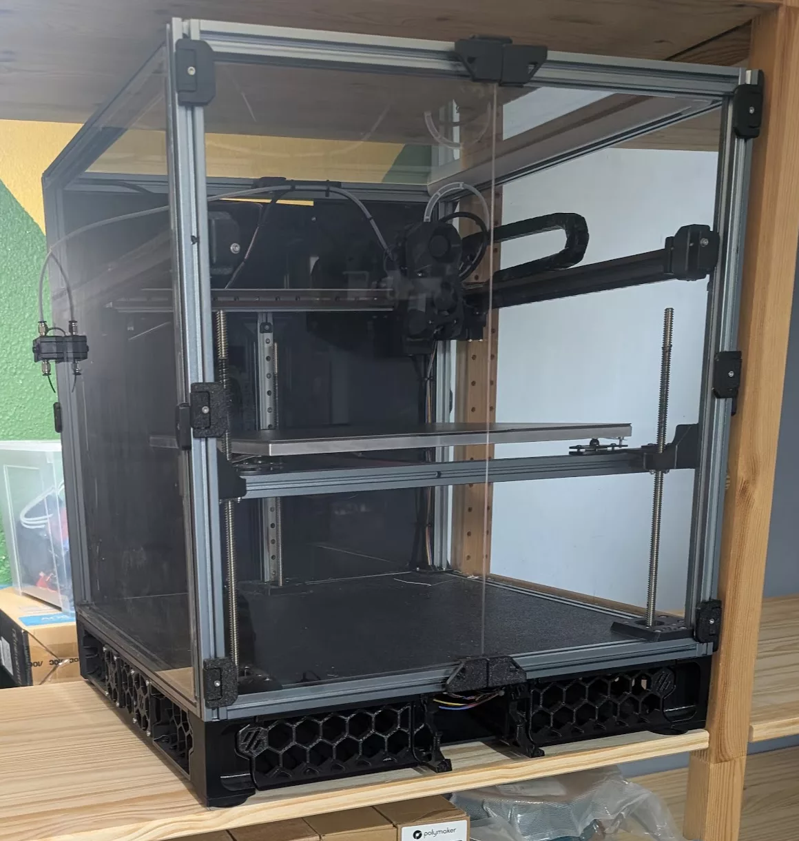 Voron Trident 3D printer on a shelf